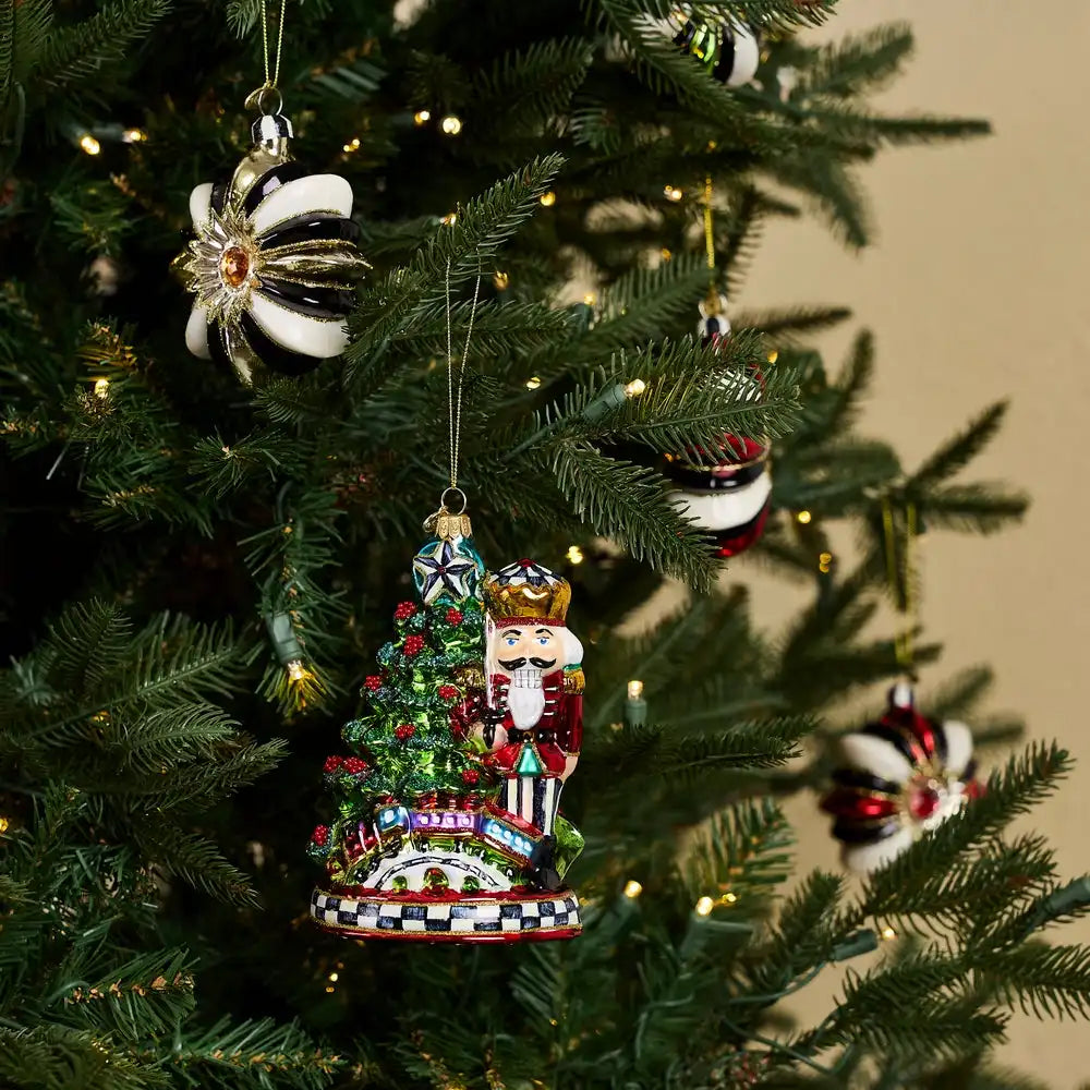 Nutcracker by Tree Glass Ornament
